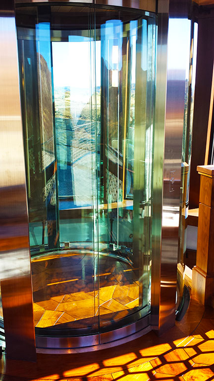 Curved glass elevator doors