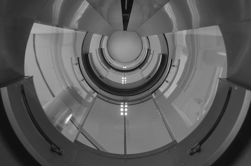 Inside the round glass elevator shaft