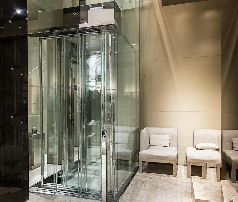 Hydraulic glass elevator in a Malibu property, designed by Roys Rise for stunning scenic views.